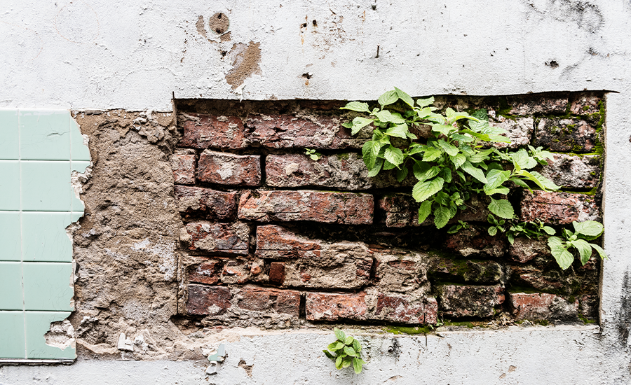 What role does brick pointing play in preventing spalling bricks?