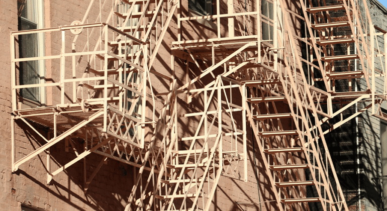 Best materials for long lasting fire escapes in NYC, showing durable steel and metal stair structures used for safe emergency exits.