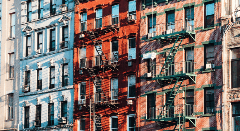 External fire escape on a historic Manhattan building showcasing iron stairs and platforms for safety and emergency access.
