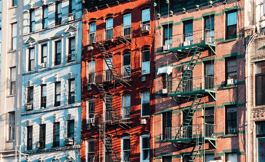 External fire escape on a historic Manhattan building showcasing iron stairs and platforms for safety and emergency access.