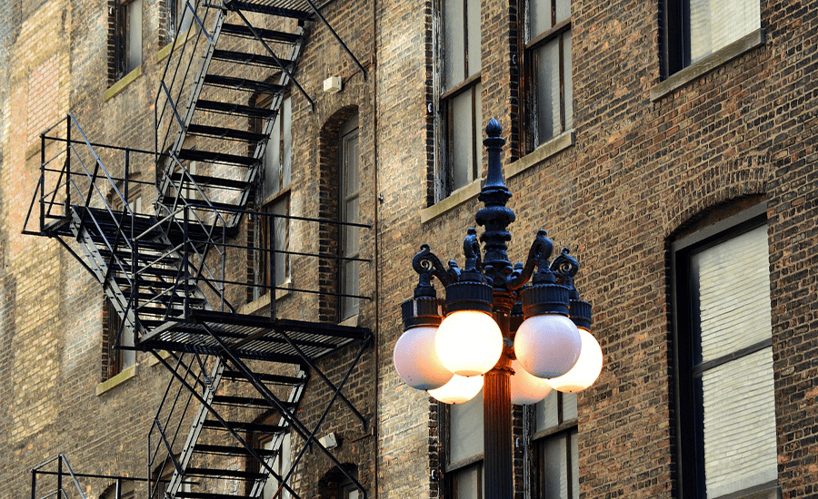 Metal fire escape attached to a New York City building showing durable steel structure and safety design