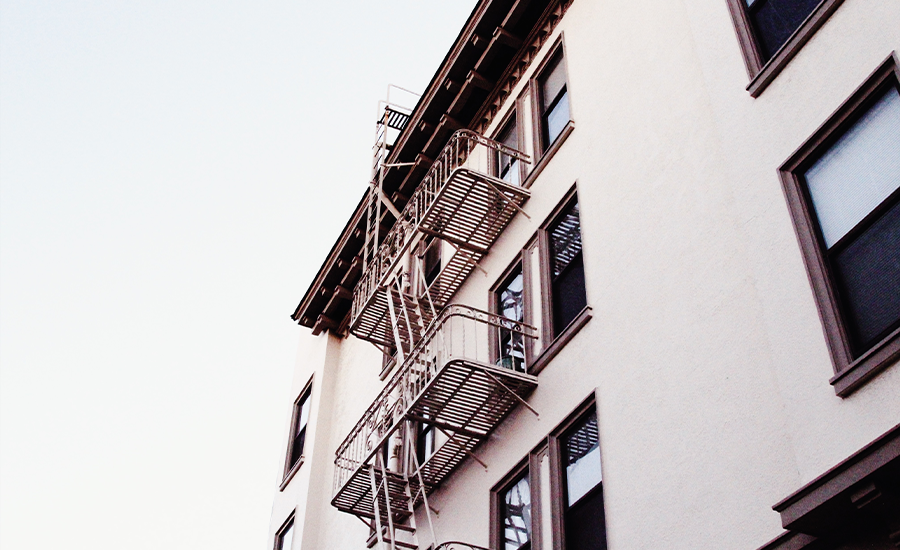 Fire escape inspection in NYC building ensuring safety code compliance by Sardar Restoration Corp