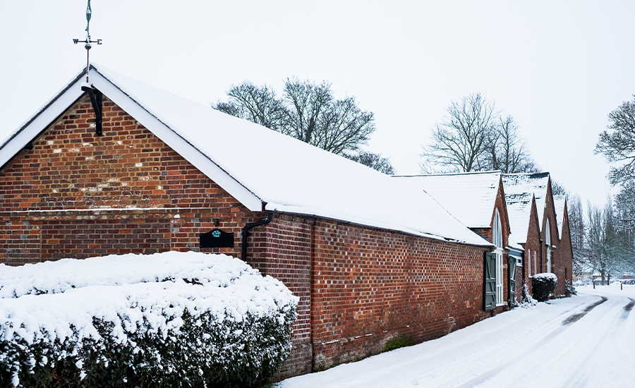 Brick wall being repointed before winter in NYC to prevent frost damage, moisture issues, and heat loss.