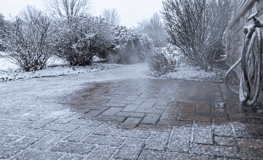 pressure washing brick patio in cold winter weather to prevent ice buildup