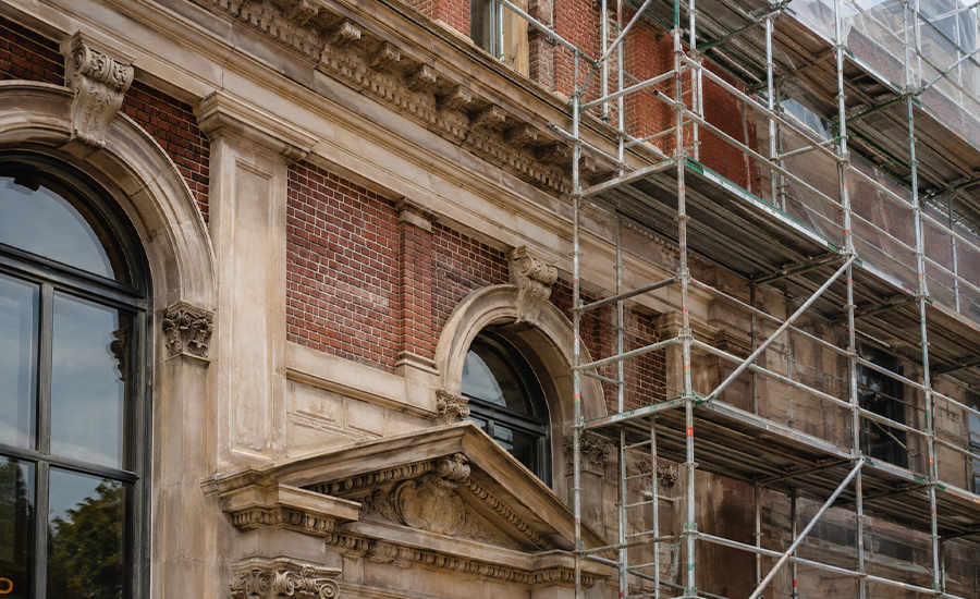 Landmark masonry restoration in NYC showing a historic brick and stone building with preserved architectural details