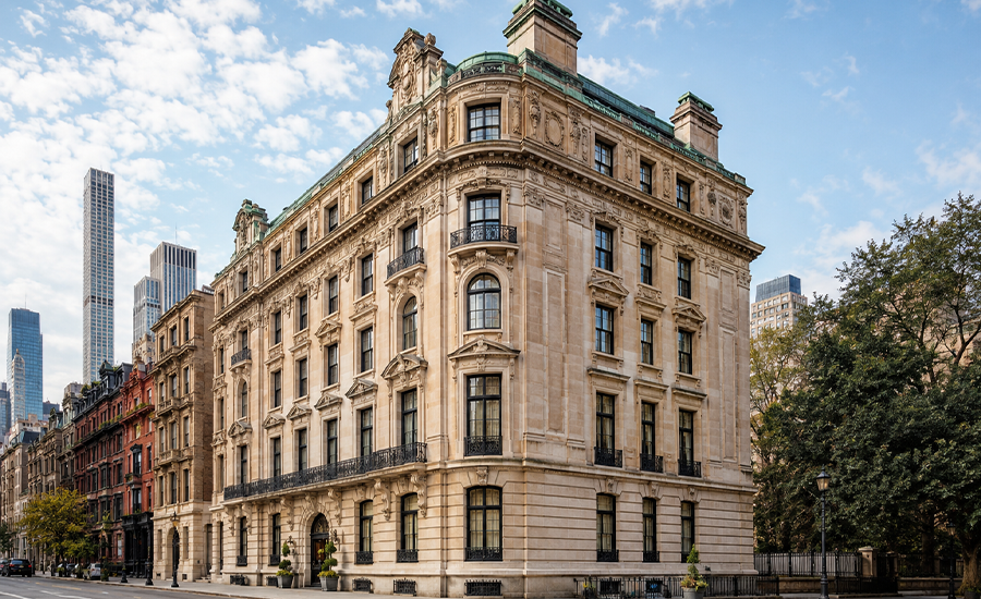 Historic NYC landmark buildings with brownstone stairs, ornate stone façades, decorative windows, and preserved architectural details.