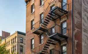 New exterior fire escape added to an existing brick building in New York City